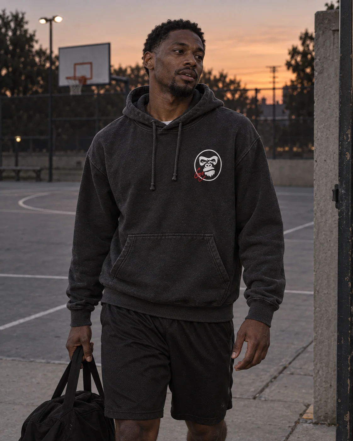Illustrative adult athlete wearing the charcoal GC Hoodie